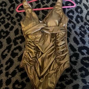 Like new gold one piece swim suit